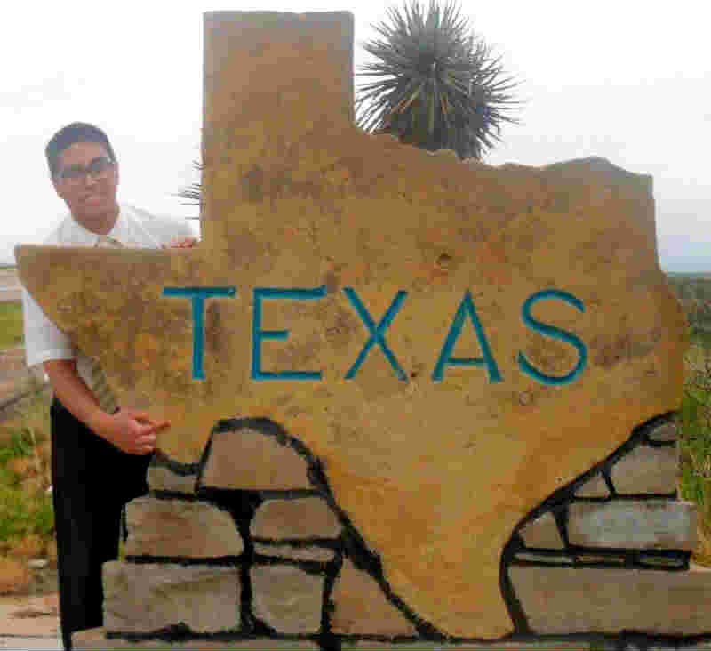 Elder Caldes with a Texas sign.